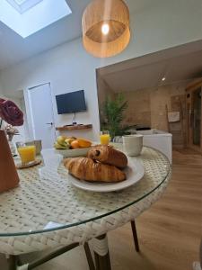 a table with a plate of bread on top of it at La Suite Balinaise in Quimper +32 photos