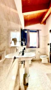 a bathroom with a sink and a toilet at Raggio di Sole in Montesilvano +19 photos