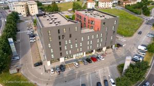an overhead view of a building with a parking lot at Schio Hotel in Schio