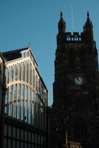 a clock tower and a building with a clock at Red Bull in Stockport