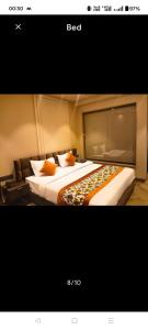 a picture of a hotel room with two beds at HotAlnovaiN in Agra