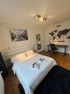 a bedroom with a bed with two babies on it at Cosy studio in Lausanne Flon in Lausanne +5 photos