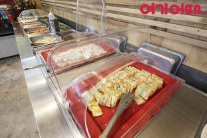 a buffet line with some food on a counter at 월호텔 in Cheonan