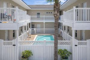 arial view of a building with a pool and balconies at Los Cabos I #5 condo in South Padre Island