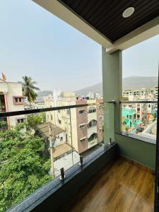 a balcony with a view of a city at Vizag Urban Nest in Visakhapatnam