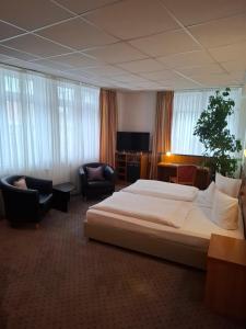 Кровать или кровати в номере Andersen Hotel Birkenwerder +35 фотографий