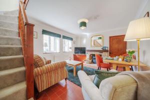 a living room with a couch and a table at Channel Cottage in Wells next the Sea