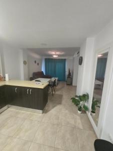 a living room with a kitchen and a dining room at Las Jarcias 2C in Moncófar