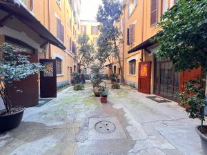 an alley with a drawing of a face on the ground at Emme Loft I Sweet Moon - Exclusive Loft & Private Spa Milan in Milan