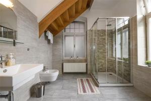 a bathroom with a sink and a shower at Villa Benedikt in Bad Gastein +83 photos