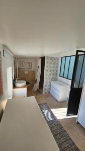a room with a bathroom with a sink and a toilet at Appartement typique in Pertuis