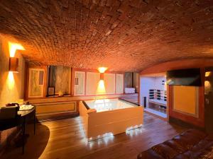 a living room with a couch and a table at Emme Loft I Sweet Moon - Exclusive Loft & Private Spa Milan in Milan +17 photos