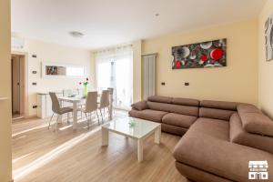 a living room with a couch and a table at CASA MIA by Design Studio in Colico