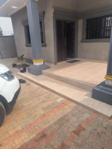 a car parked in front of a building with columns at Villa Moderne 4 Chambres avec Suite in Loué