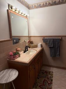 a bathroom with a sink and a mirror at Diamond Retreat in Sweeden +18 photos
