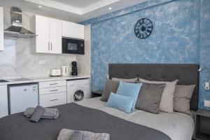 a bedroom with a bed with a clock on the wall at Ocean View Ponderosa 601 Costa Adeje Playa de las Americas in Costa de Adeje