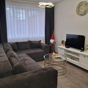 a living room with a couch and a santa hat at Apartman Veka KV in Kraljevo