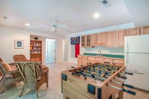 a kitchen with a large game table at 3215 - Papa Duck in Duck
