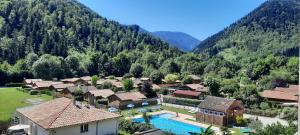 an aerial view of a resort in the mountains at La Taillade de Montségur location de Chalets en bois in Fougax-et-Barrineuf