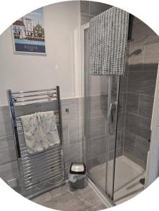 a shower in a bathroom with a glass door at The Piggery - Corfe Mullen in Corfe Mullen