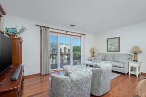 a living room with a couch and chairs at 4205 - Schwartz in Duck
