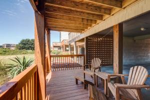 two chairs on a porch with a wooden deck at 4205 - Schwartz in Duck