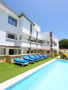 an image of a villa with a swimming pool at Ntate Homes, Diani Near the Beach in Diani Beach