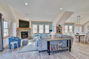 a living room with a couch and a fireplace at 4749 - Salty Dawgs in Kitty Hawk Beach