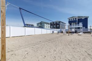 a volleyball court on the beach in front of a building at 4759 - Sun Daze in Kitty Hawk Beach
