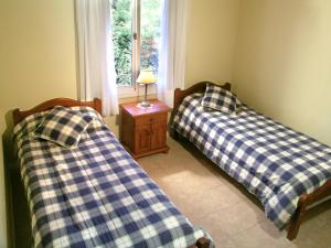 Llit o llits en una habitació de Solar Encantado Cabañas & Chalet