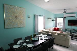 a living room with a table and a couch at Villa Blue Nights in Saint James