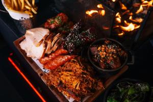 a tray of food with meat and other foods at Cave Hotel & Golf Resort in Faversham