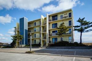 an apartment building with two tall buildings at 5695 - Pelican's Perch in Nags Head