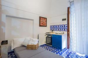 a bathroom with a sink and a bed in a room at A casa di Gennarino in Cetara