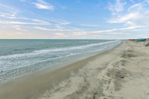 an empty beach with the ocean in the background at 5725 - A Dream Vacation in Nags Head