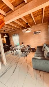 a living room with a couch and a table at Morski Zakątek in Rowy