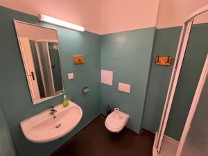 a bathroom with a sink and a toilet at Artillery Barracks Accommodation in Terezín +62 photos