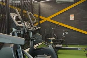 a gym with two exercise bikes in a room at Single Ensuite Rooms In Central Preston in Preston +18 photos