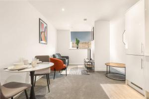 a white living room with a table and chairs at Stylish 1 BED Apartment in Central Hull in Hull +22 photos