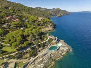 an aerial view of a rocky island in the ocean at Capo d 'Arco - Agrumeto in Capo D'Arco