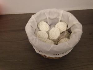 a basket filled with white flowers on the floor at Atrium in Ypres