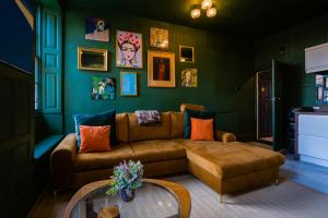 a living room with a couch and a table at The Old House Apartment in Shrewsbury