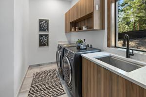 a kitchen with a black dishwasher next to a sink at Onyx in Cle Elum +56 photos