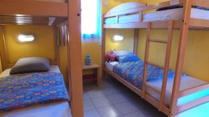 a bunk bed room with two beds and a bunk bed at VVF Sud Vercors in Die +24 photos