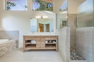 a bathroom with a sink and a mirror at Lakeside in Ronald +54 photos