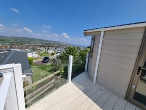 a view from the balcony of a house with a garage at Swanage Caravan in Swanage