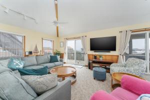 a living room with a couch and a tv at 7651 - Sandrose in Avon