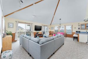 a living room with a couch and a tv at 7651 - Sandrose in Avon