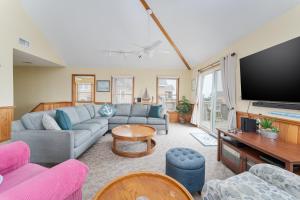 a living room with a couch and a flat screen tv at 7651 - Sandrose in Avon +20 photos