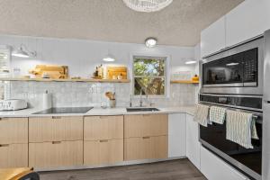 a kitchen with a sink and a stove at 7850 - Nepenthe in Frisco